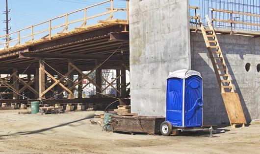 work site porta potties lined up for workers' use